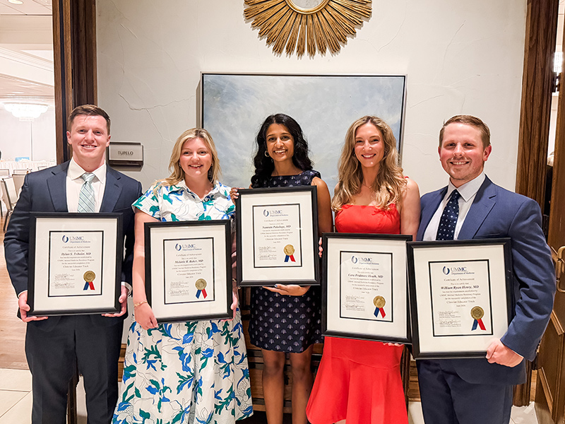 Group photo of 2026 CET Graduates holding framed certificates.